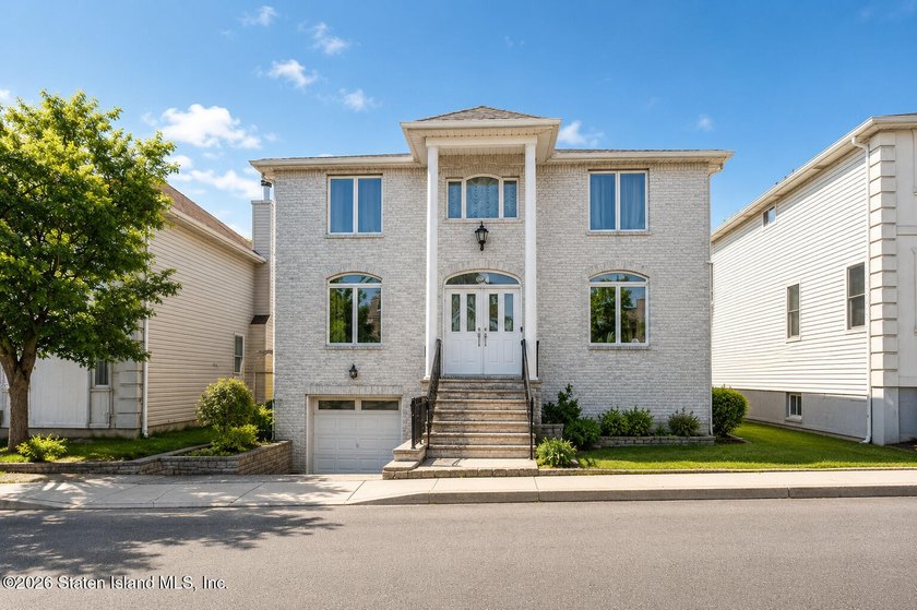 Welcome to this spacious Center Hall Colonial nestled in a - Beach Home for sale in Staten Island, New York on Beachhouse.com