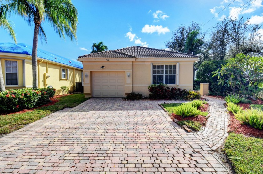 Nestled on a spectacular private tropically landscaped lot with - Beach Home for sale in Delray Beach, Florida on Beachhouse.com