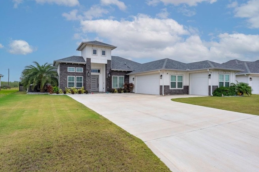 This exquisite custom-built home offers 4 bedrooms, 3 full baths - Beach Home for sale in Laguna Vista, Texas on Beachhouse.com