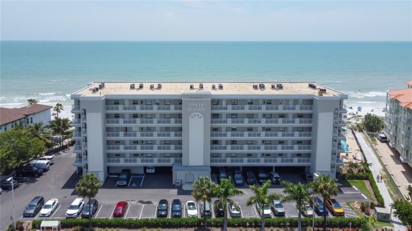 Discover this stunning, turnkey, fully furnished Gulf-front - Beach Condo for sale in Indian Shores, Florida on Beachhouse.com