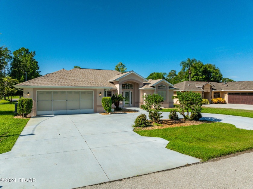 Discover this stunning pool home in a charming neighborhood - Beach Home for sale in Palm Coast, Florida on Beachhouse.com