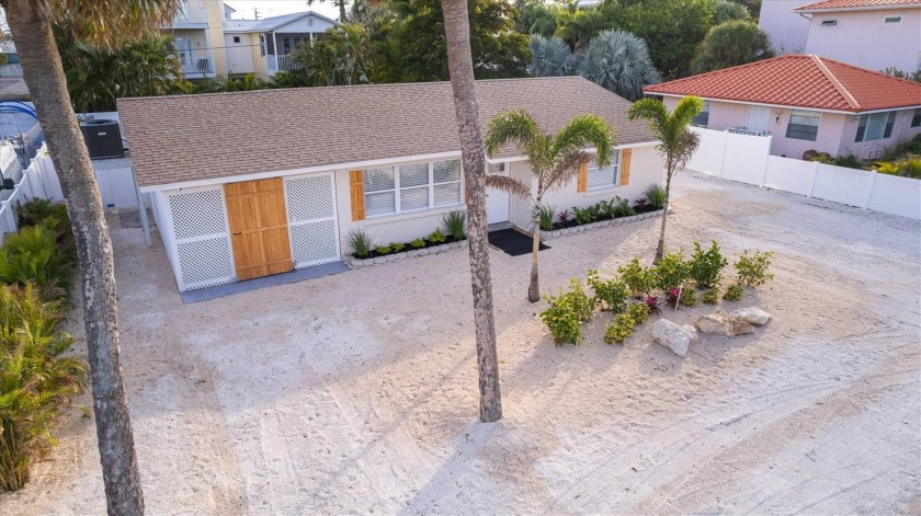 Step into this impeccable, fully remodeled beach cottage on a - Beach Home for sale in Holmes Beach, Florida on Beachhouse.com