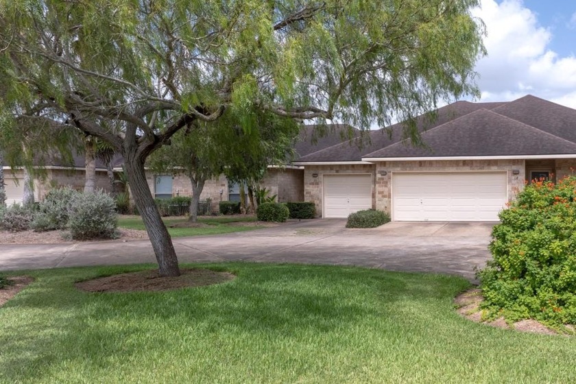 This 2-bedroom, 2-bath golf villa offers serene lake views from - Beach Townhome/Townhouse for sale in Laguna Vista, Texas on Beachhouse.com