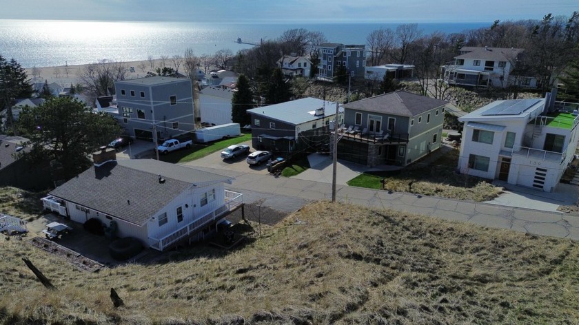 Discover the unmatched charm of 134 Prospect! Perched atop Grand - Beach Lot for sale in Grand Haven, Michigan on Beachhouse.com