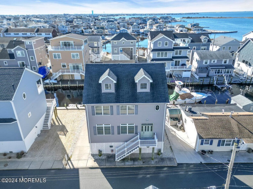 Step into a spacious lagoon-front haven in Sunset Manor, where - Beach Home for sale in Lavallette, New Jersey on Beachhouse.com