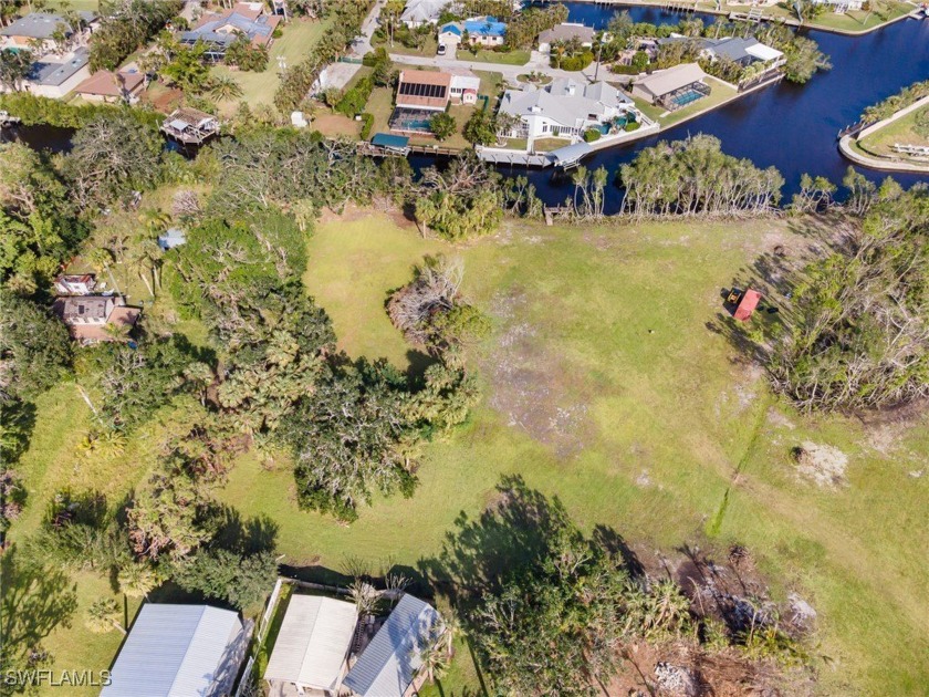 Price adjustment.  One full acre of waterfront with private - Beach Lot for sale in North Fort Myers, Florida on Beachhouse.com