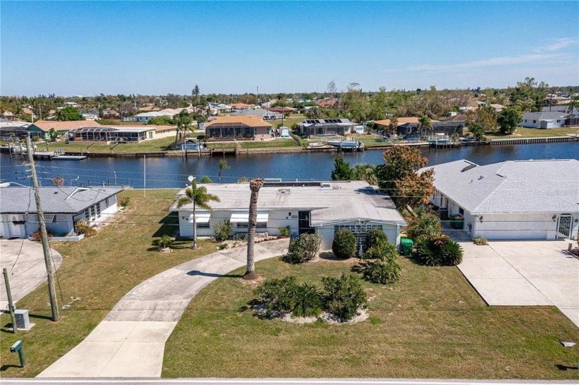 PORT CHARLOTTE WATERFRONT HOME W/80FT OF WATER FRONTAGE, WIDE - Beach Home for sale in Port Charlotte, Florida on Beachhouse.com