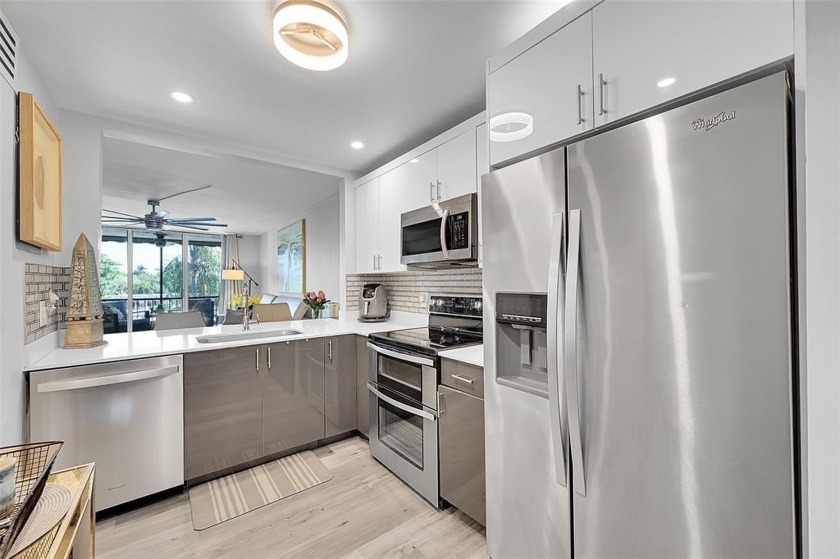 As you enter this beautifully designed home, you are greeted by - Beach Condo for sale in Pompano Beach, Florida on Beachhouse.com