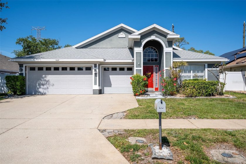 Welcome to 624 N Lake Blvd, a beautifully maintained home tucked - Beach Home for sale in Tarpon Springs, Florida on Beachhouse.com