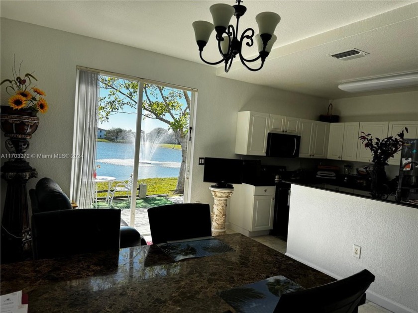 Enjoy every morning with the breathtaking lake view while eating - Beach Condo for sale in Homestead, Florida on Beachhouse.com