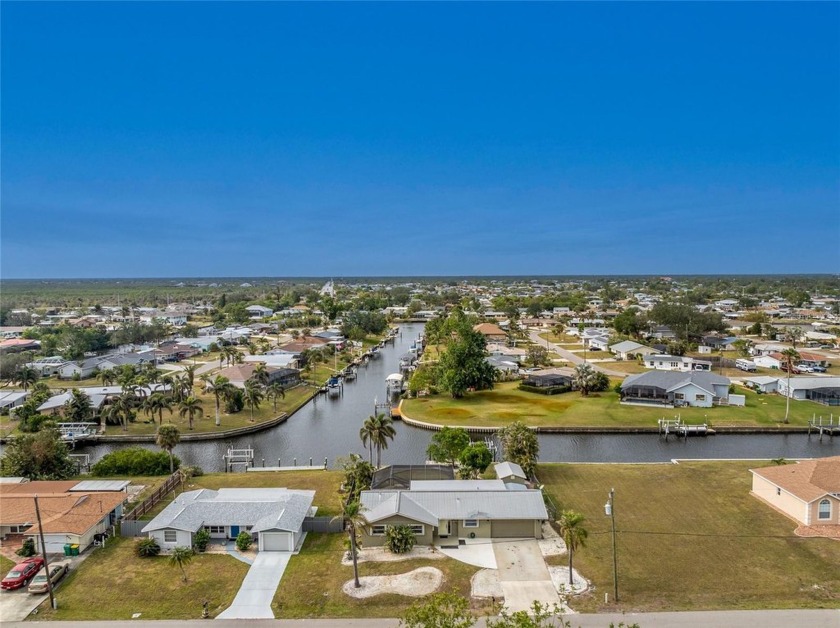 This TURNKEY furnished, Gulf-access pool home is a dream come - Beach Home for sale in Port Charlotte, Florida on Beachhouse.com