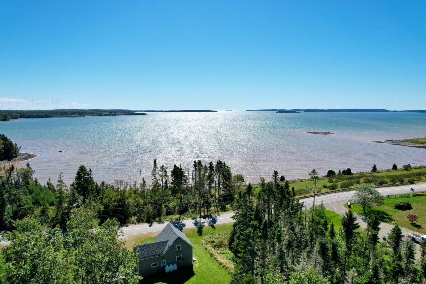 Discover this charming Maine cottage on Holmes Bay, nestled on - Beach Home for sale in Whiting, Maine on Beachhouse.com