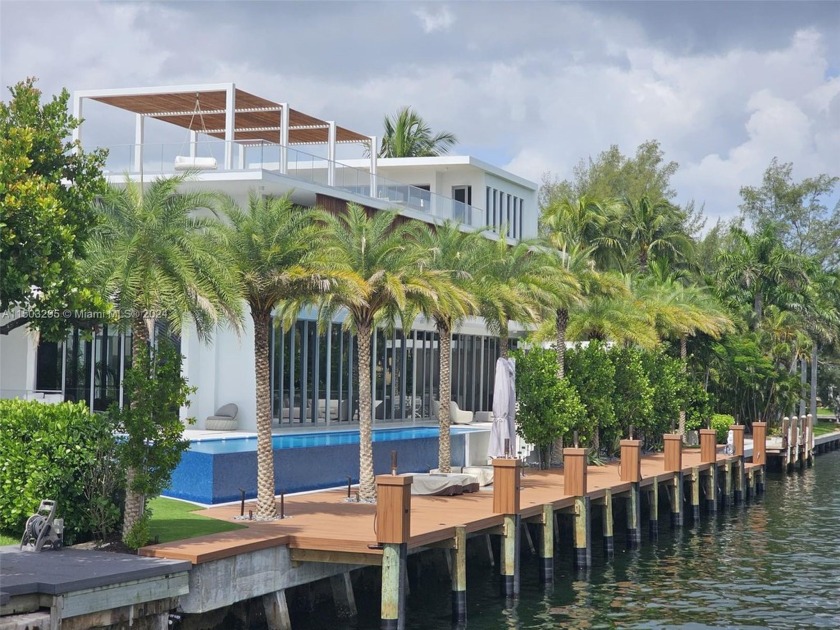 This  6-bed, 8-bath waterfront home offers 163 ft  2,000 sq ft - Beach Home for sale in North Miami, Florida on Beachhouse.com