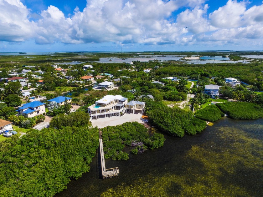 Masterfully crafted, describes this coastal estate located - Beach Home for sale in Cudjoe Key, Florida on Beachhouse.com