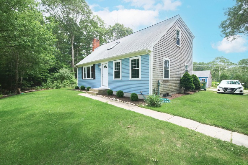 Nestled high on a lush, expansive lot and set back from the - Beach Home for sale in Sandwich, Massachusetts on Beachhouse.com