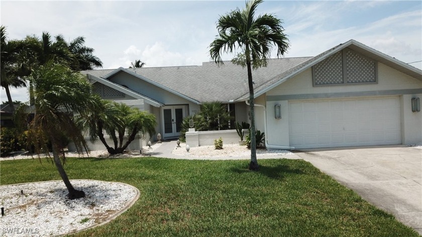 This stunning three-bedroom, two-bathroom pool home offers over - Beach Home for sale in Cape Coral, Florida on Beachhouse.com