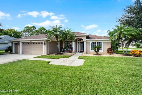 This exquisite three-bedroom, two-bathroom pool home, complete - Beach Home for sale in Port Orange, Florida on Beachhouse.com