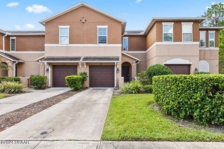 So close, yet tucked away, is this beautiful townhome. Visible - Beach Townhome/Townhouse for sale in Daytona Beach, Florida on Beachhouse.com