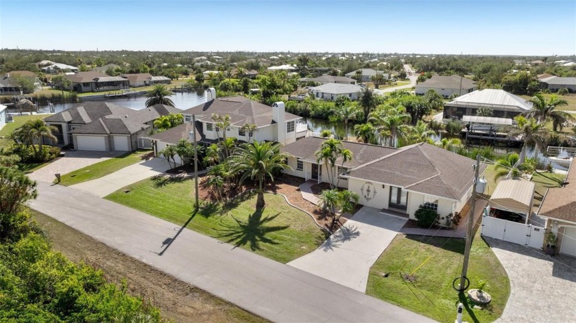 Experience waterfront living at its finest with this - Beach Home for sale in Port Charlotte, Florida on Beachhouse.com