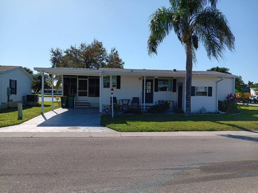 This charming 2/2 manufactured home is located in Tall Oaks - Beach Home for sale in Naples, Florida on Beachhouse.com