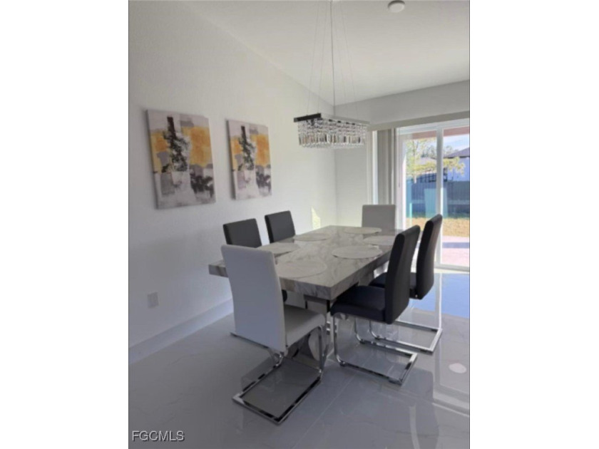 Welcome to this beautifully designed 3-bedroom, 2-bath home - Beach Home for sale in Lehigh Acres, Florida on Beachhouse.com