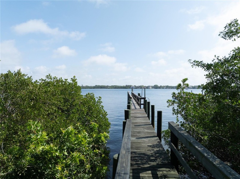 This rare and coveted 1-acre flag lot extends down to the Little - Beach Lot for sale in Sarasota, Florida on Beachhouse.com
