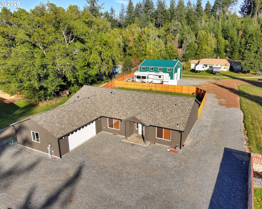 2023-built home set on nearly an acre of level, usable land - Beach Home for sale in Gold Beach, Oregon on Beachhouse.com