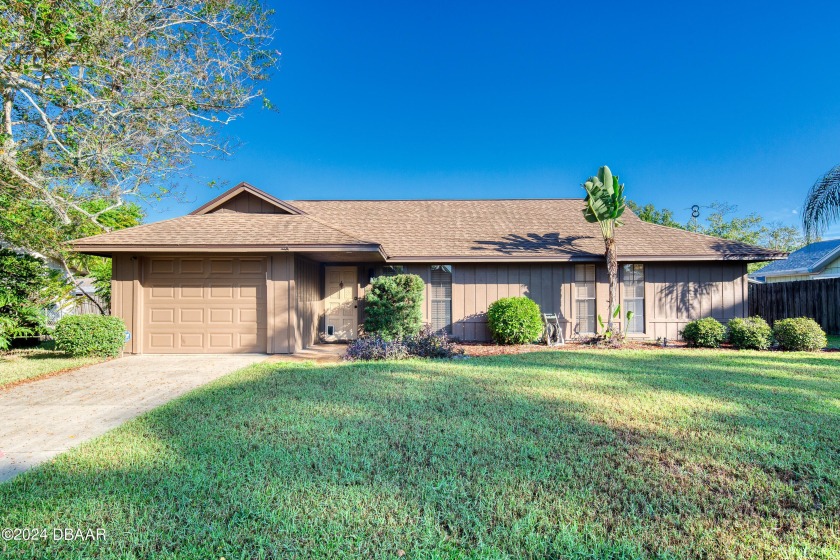 Lovely well maintained 4-bedroom, 2.5-bathroom home with a 1-car - Beach Home for sale in Ormond Beach, Florida on Beachhouse.com