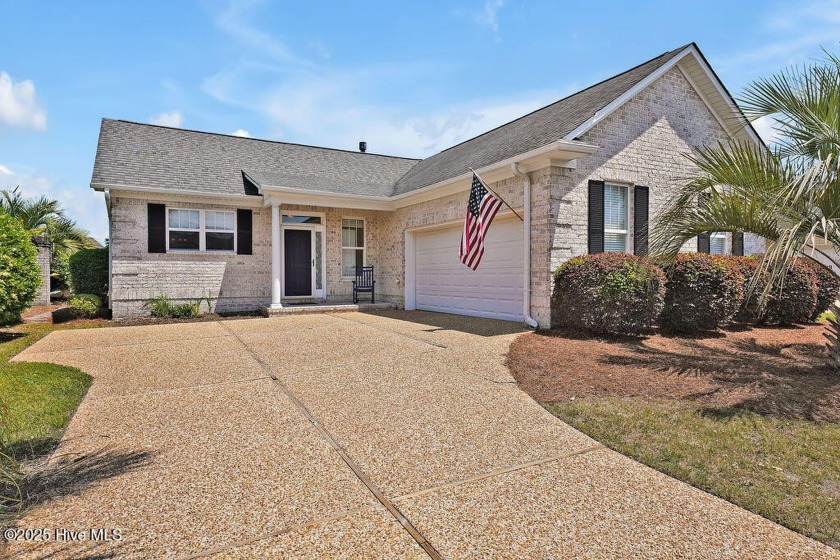 A brick home situated on a quiet street in The Gardens - Beach Home for sale in Leland, North Carolina on Beachhouse.com