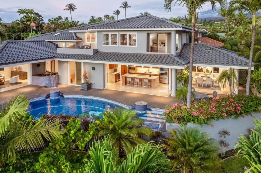 Set prominently on an elevated corner lot within the exclusive - Beach Home for sale in Kihei, Hawaii on Beachhouse.com