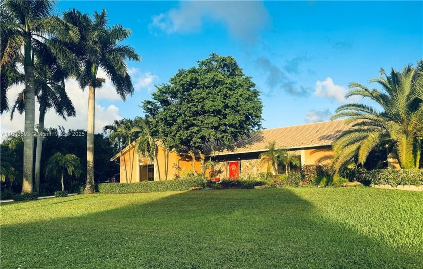 ESCAPE TO THIS CUSTOM 4 BEDROOM BLDR ACRE ESTATE HOME THAT IS - Beach Home for sale in Davie, Florida on Beachhouse.com