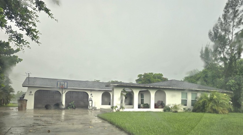 This centrally located home overlooking the lake! It has 2 car - Beach Home for sale in Lehigh Acres, Florida on Beachhouse.com