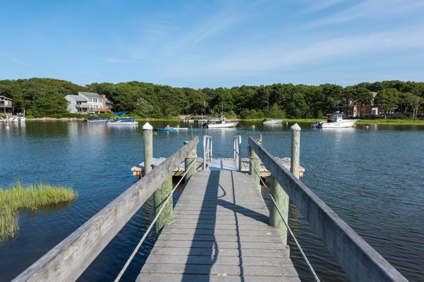 A Cape Cod waterfront retreat privately set on the coveted - Beach Home for sale in Mashpee, Massachusetts on Beachhouse.com