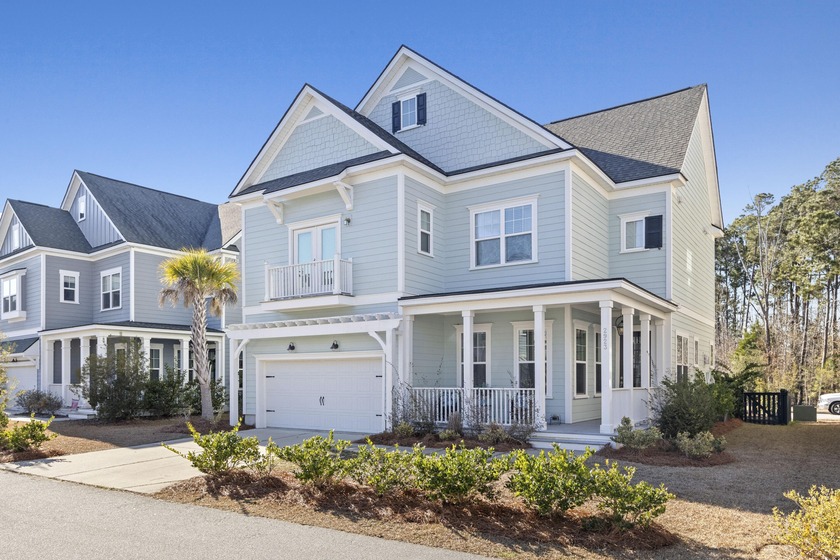 Welcome home to this light-filled coastal retreat tucked inside - Beach Home for sale in Mount Pleasant, South Carolina on Beachhouse.com