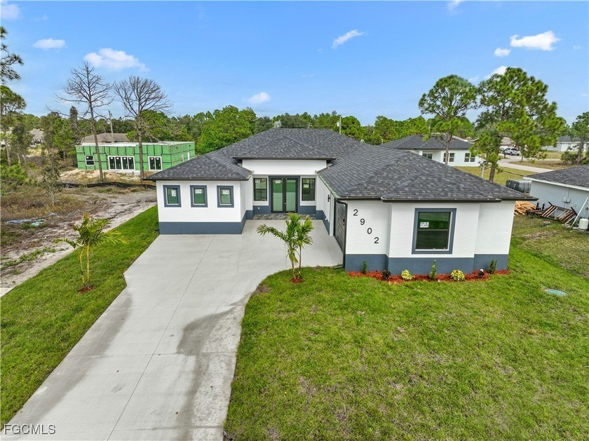 Welcome to this stunning new-build (2026) home on a spacious - Beach Home for sale in Lehigh Acres, Florida on Beachhouse.com
