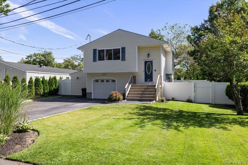 Welcome to this beautifully updated High Ranch, perfectly - Beach Home for sale in Patchogue, New York on Beachhouse.com