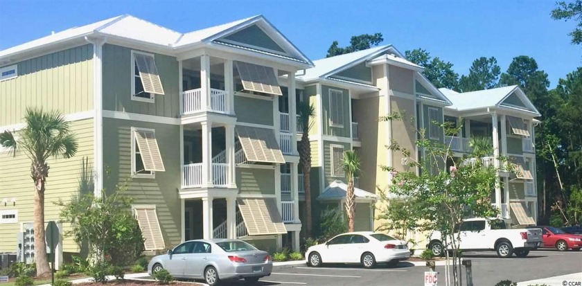 Located in the heart of Pawleys Island, this end unit condo - Beach Condo for sale in Pawleys Island, South Carolina on Beachhouse.com