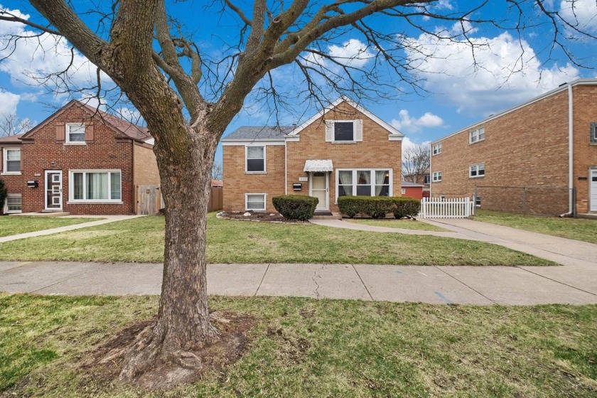 Welcome home to this charming JUMBO brick split-level in the - Beach Home for sale in Skokie, Illinois on Beachhouse.com