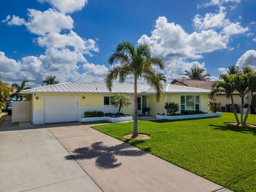 Experience elevated waterfront living in this beautifully - Beach Home for sale in Cape Coral, Florida on Beachhouse.com