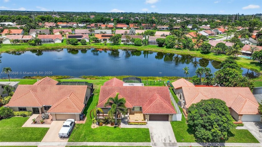 Welcome home to this stunning lakefront pool home in the - Beach Home for sale in Boynton Beach, Florida on Beachhouse.com