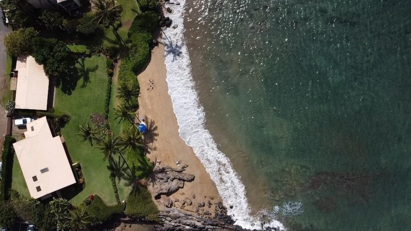 This spectacular Maui beachfront property sits on Maui's South - Beach Home for sale in Kihei, Hawaii on Beachhouse.com