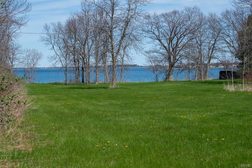 Enjoy captivating sunsets and strolls along the shore. This - Beach Lot for sale in Cape Vincent, New York on Beachhouse.com