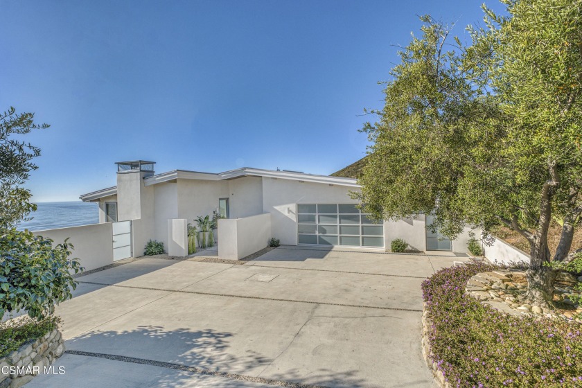 Set against the serene hillside overlooking the iconic Zuma - Beach Home for sale in Malibu, California on Beachhouse.com