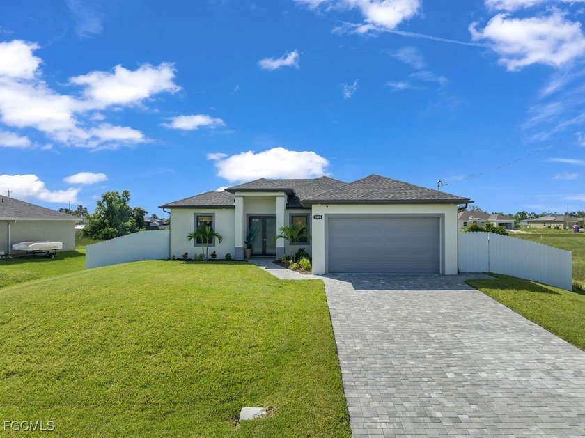 This nearly-new construction home checks every box, featuring a - Beach Home for sale in Cape Coral, Florida on Beachhouse.com