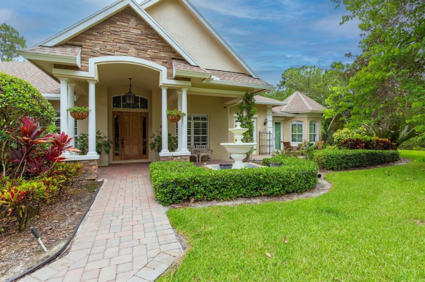 Retreat to this charming estate home situated on 5.19 luscious - Beach Home for sale in West Palm Beach, Florida on Beachhouse.com