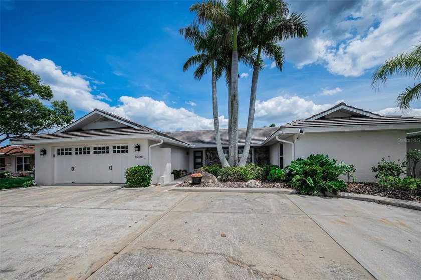 This stylishly updated Gulf Harbors home is located on one of - Beach Home for sale in New Port Richey, Florida on Beachhouse.com
