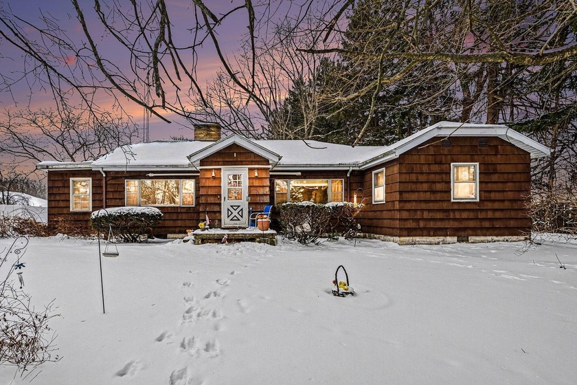 Tucked away on a wooded lot just inside the St. Joseph city - Beach Home for sale in Saint Joseph, Michigan on Beachhouse.com