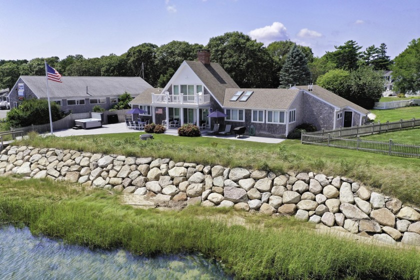 Located on picturesque Bass River, this turnkey waterfront home - Beach Home for sale in South Yarmouth, Massachusetts on Beachhouse.com