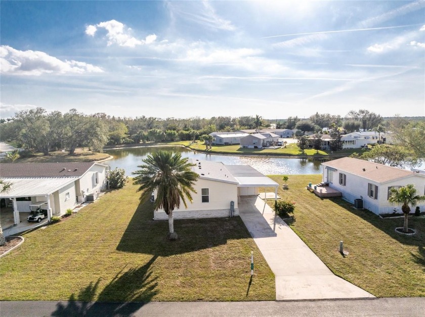 Charming Lakefront 2-Bedroom Home in 55+ Community! Welcome to - Beach Home for sale in Punta Gorda, Florida on Beachhouse.com