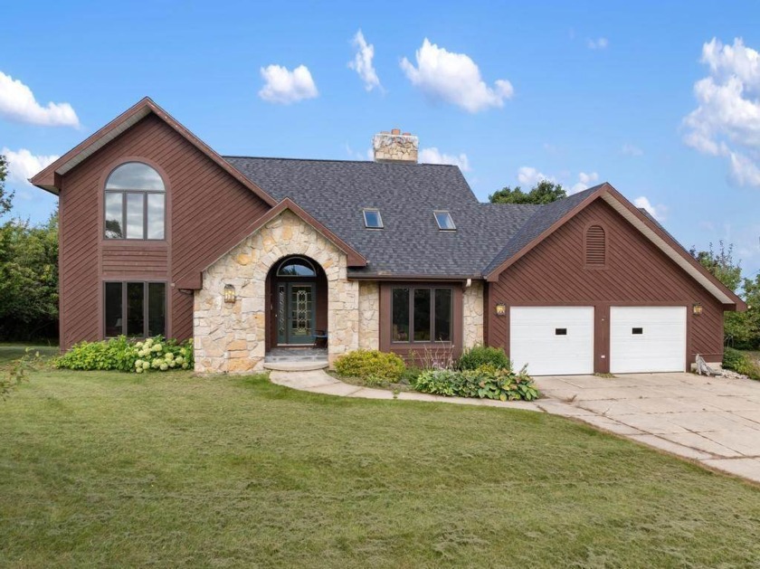 Discover the perfect blend of style, comfort and functionality - Beach Home for sale in Charlevoix, Michigan on Beachhouse.com